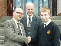 Lower Sixth pupil Kevin O'Reilly from Bessbrook is congratulated on his outstanding
success in the June examinations by Mr. Barry Turley, Guest Speaker and Mr. Dermot
McGovem, Headmaster at the Achievement Prizegiving Ceremony in the Abbey
Christian Brothers' Grammar School; Kevin achieved 11 A * grades at GCSE and
even though he was only a fifth year pupil he also obtained a grade A in A-level
Mathematics.